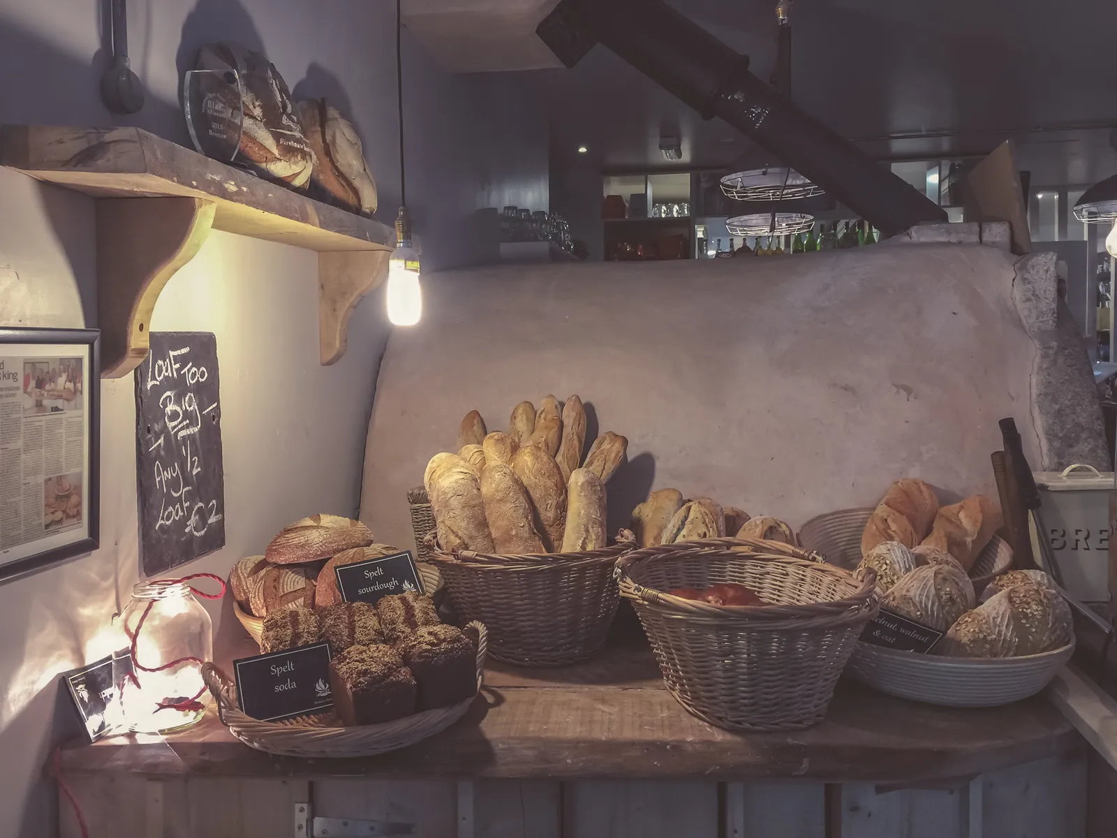 Loaves of crusty artisan bread on a wooden surface. The photo was not taken in Marietta.