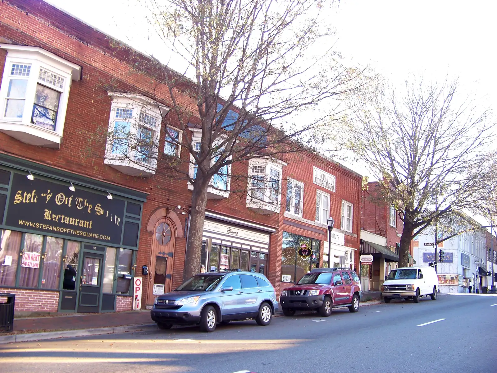 Restaurants and shops in brick storefronts in downtown Marietta, a short walk from the Saturday markets on Mill Street.