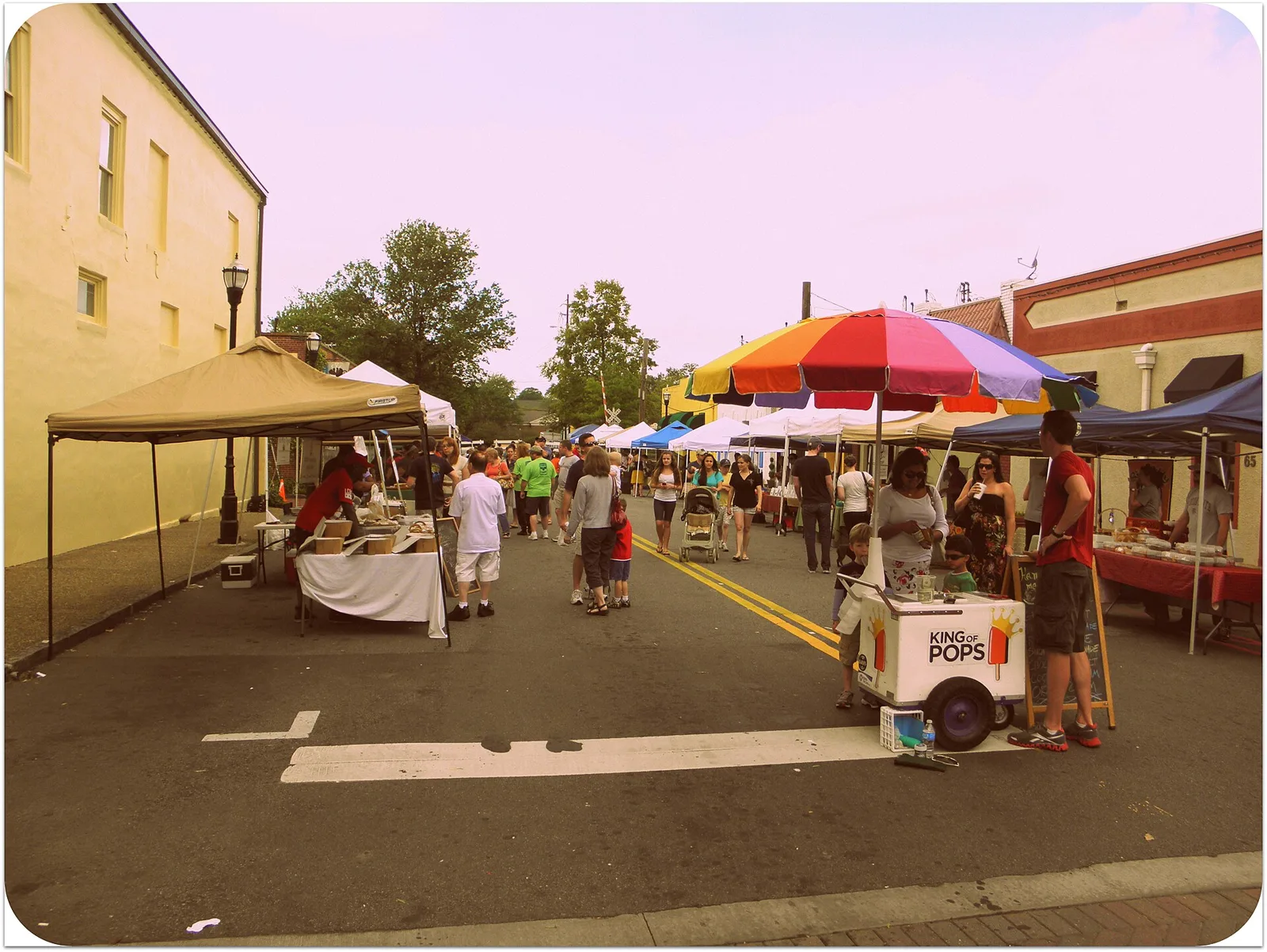 Shoppers and vendor tents at the Marietta Square Farmers Market, just off the Square