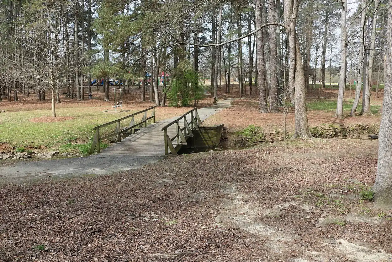A footbridge over the stream between the ponds at Laurel Park on Manning Road in west Marietta