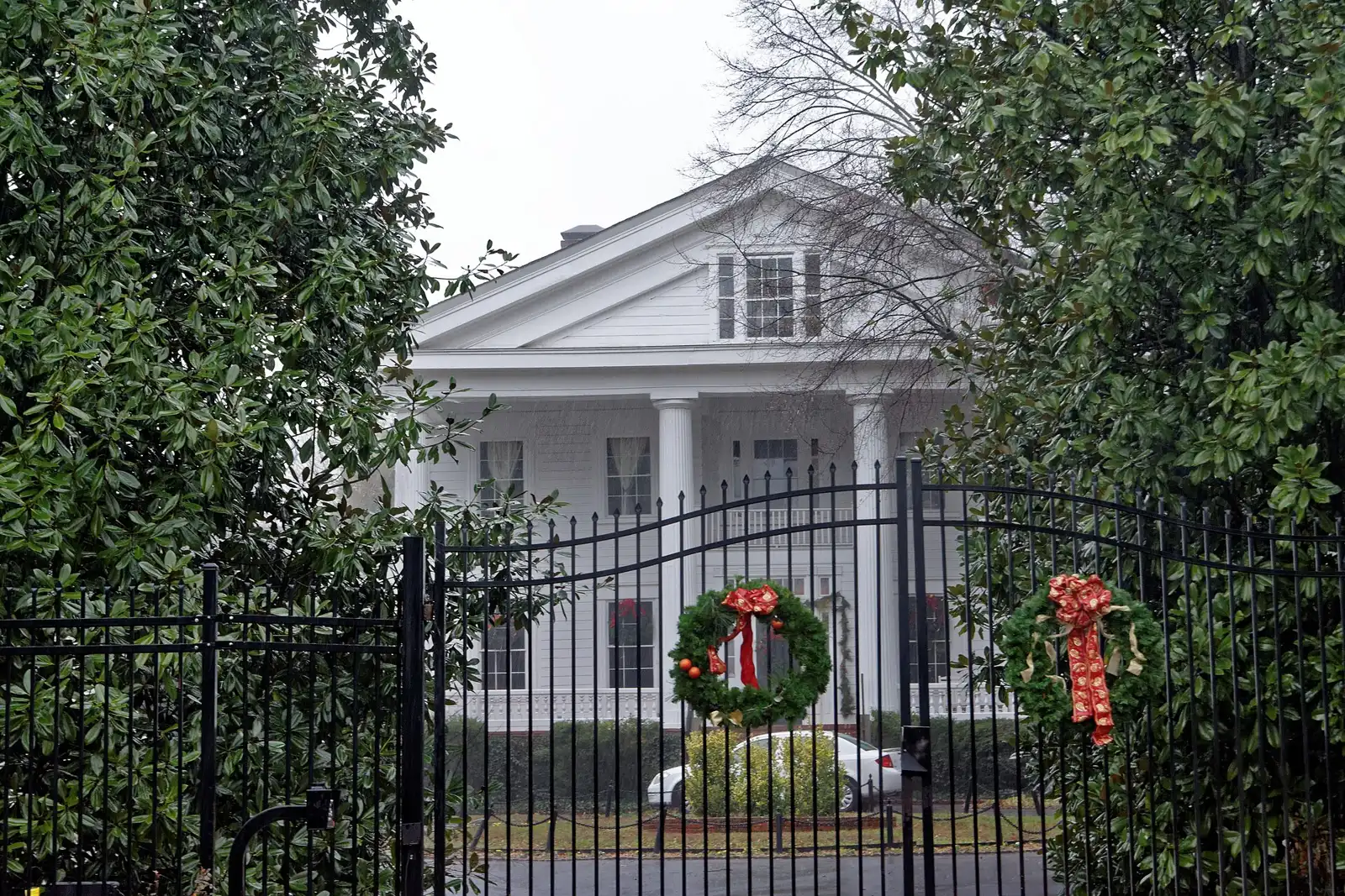 Christmas wreaths on the gates of the Glover-McLeod-Garrison House, a historic home in Marietta