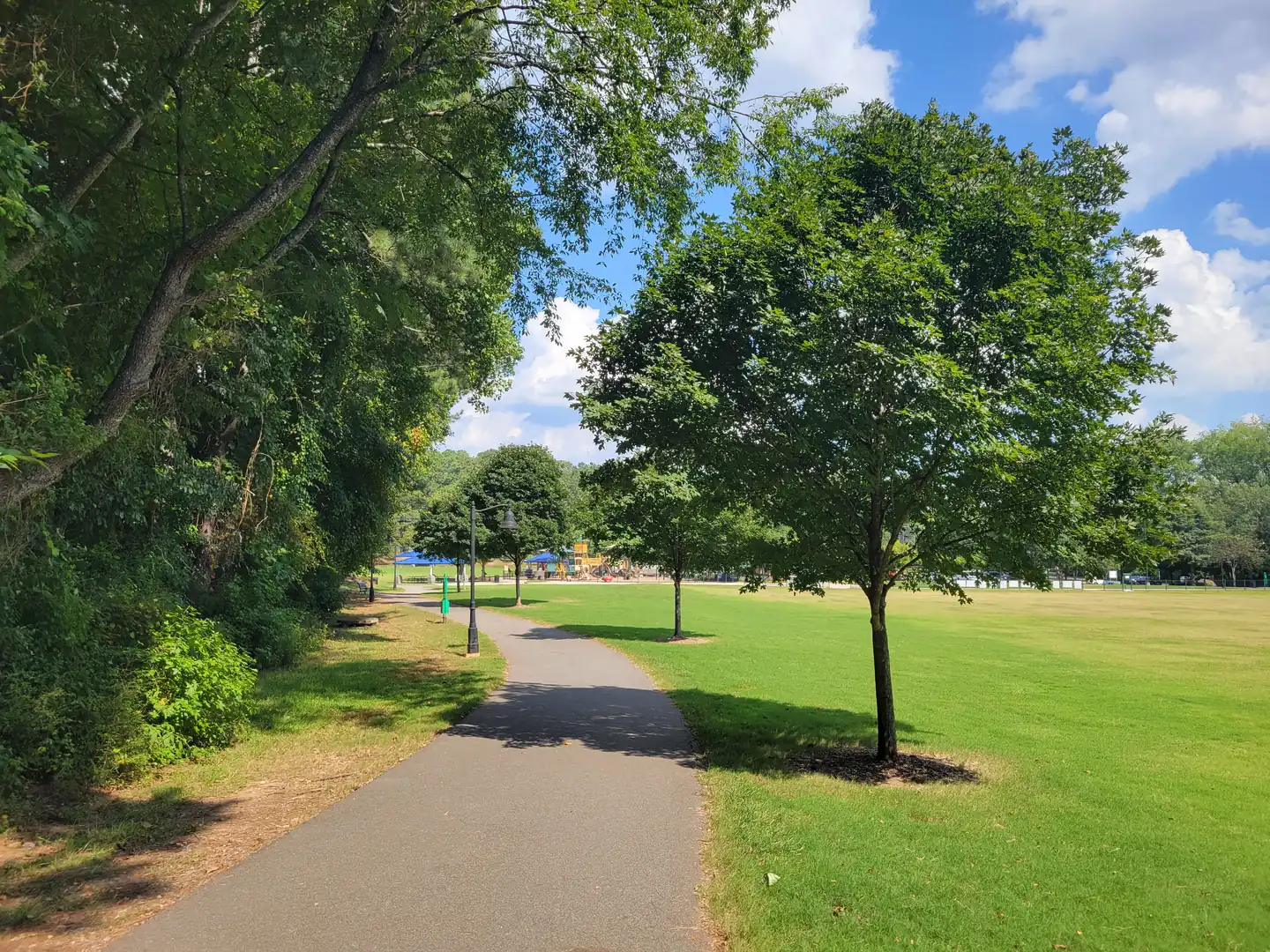 A paved path at Tumlin Park at Hickory Hills, a city park on Chestnut Hill Road