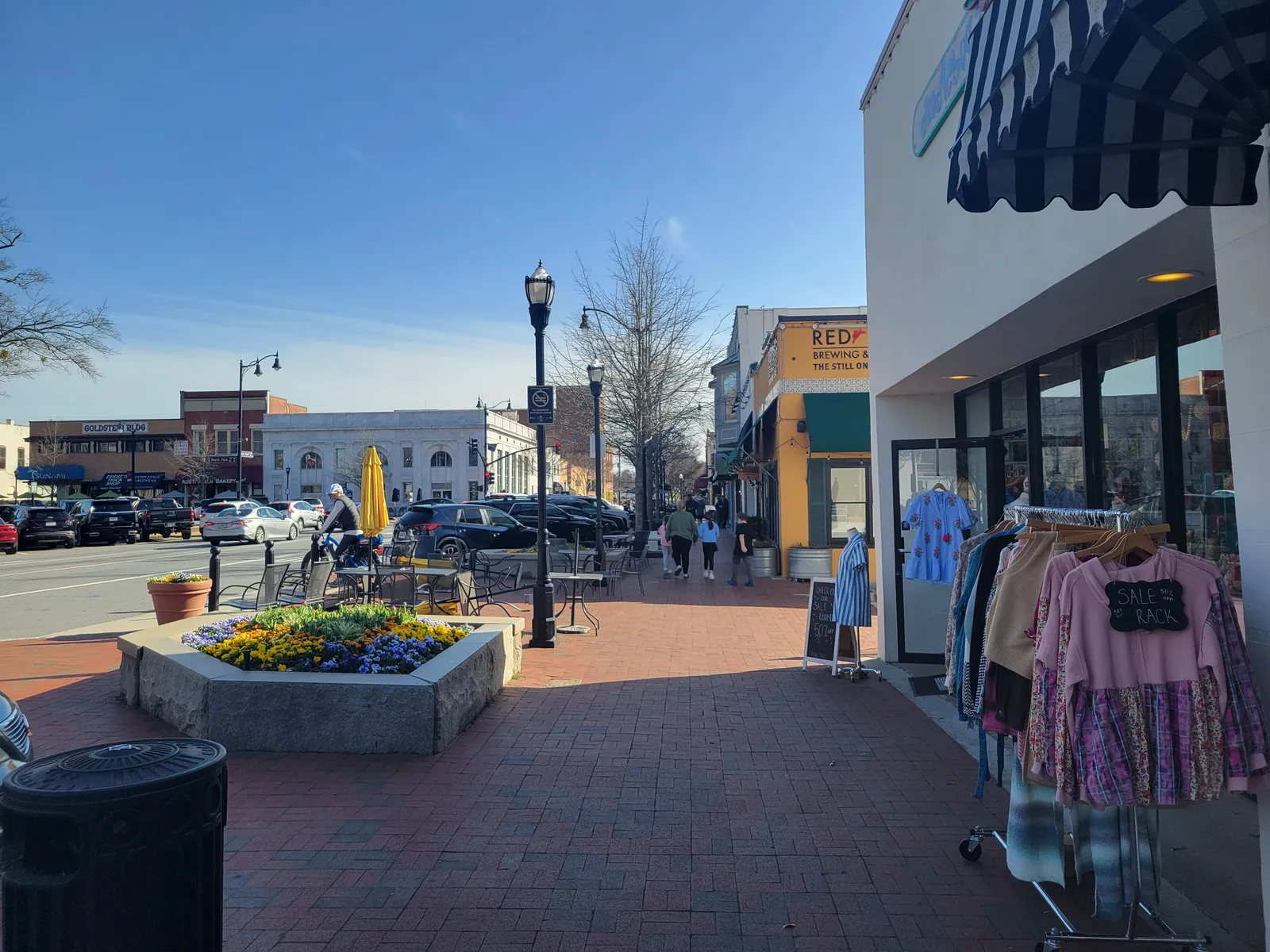 Sidewalk tables and storefronts along West Park Square in downtown Marietta